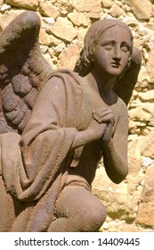 Statue Of Angel. Rusty Iron Sculpture From Cementery.