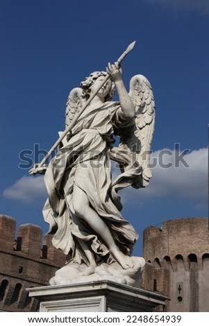 statue of an angel with a spear near the castle of the holy angel, Rome, Italy