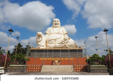 Statue of Budai (Laughing Buddha) at Vinh Trang Temple in My Tho, Vietnam. Written mantra translates to: "I bow to Maitreya, the honored future Buddha."