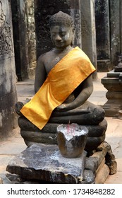 Statue Of The Buddha With A Gold Sash 