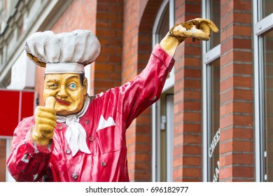 A statue of a cook