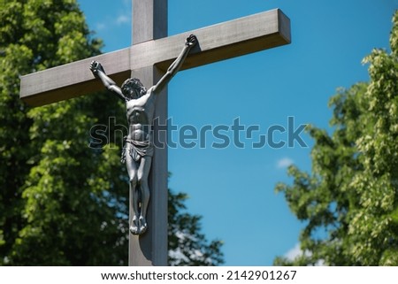 statue of the crucified jesus on a wooden cross