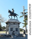 Statue of Date Masamune in Sendai castle, sendai, japan. The letters reads " Date Masamune ".