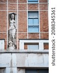 statue and detail of The building for homes and offices overlooking Via della Posta and Piazza degli Affari designed by Emilio Lancia in 1939