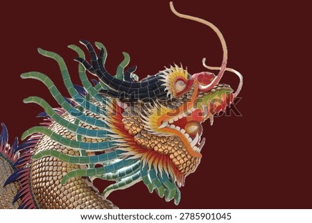 A statue of a dragon in a ferocious pose.