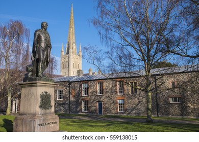 A statue of the Duke of Wellington with the beautiful Norwich Cathedral in the background, in the historic city of Norwich, UK.