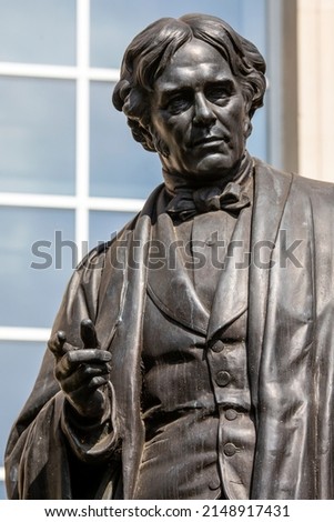 A statue of famous English scientist Michael Faraday, located on Savoy Place in central London, UK.