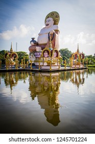 Statue Of A Fat Chinese Priest In Buddhist Temple At Koh Samui,Thailand.