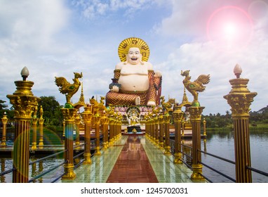 Statue Of A Fat Chinese Priest In Buddhist Temple At Koh Samui,Thailand.