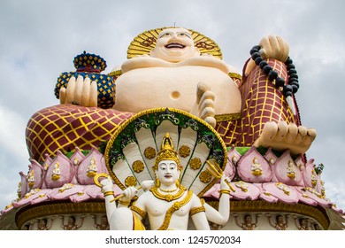 Statue Of A Fat Chinese Priest In Buddhist Temple At Koh Samui,Thailand.