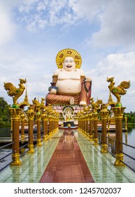 Statue Of A Fat Chinese Priest In Buddhist Temple At Koh Samui,Thailand.