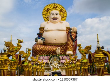 Statue Of A Fat Chinese Priest In Buddhist Temple At Koh Samui,Thailand.