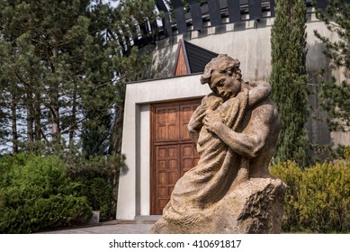 Statue Of Father And Son Hugging Each Other