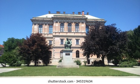 Statue in front of building. 