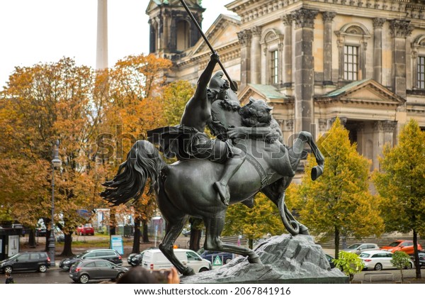Statue of the goddess of battle in front\
of the museum on Museum Island, Berlin,\
Germany