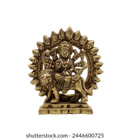 statue of goddess durga devi of hindu religion holding multiple weapons in her many arms, sitting on her lion, handcrafted with details in golden brass isolated in a white background