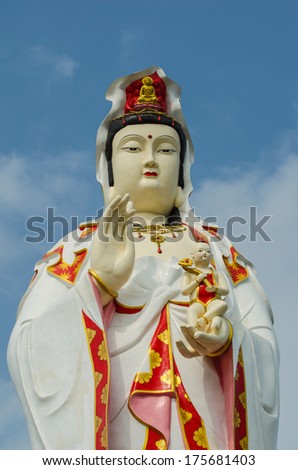 statue of the goddess Guanyin with blue sky 