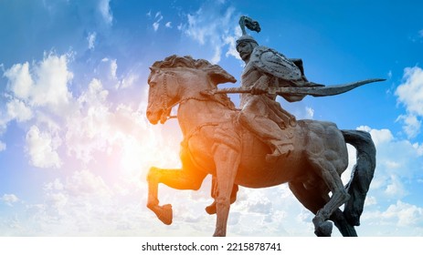 Statue of the hero Manas representing the epic of Manas against the background of the sky of Kyrgyzstan on Alatau Square in Bishkek KYRGYZSTAN