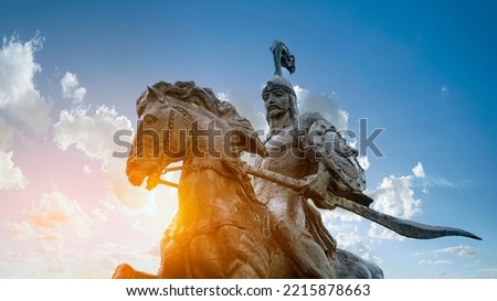 Statue of the hero Manas representing the epic of Manas against the background of the sky of Kyrgyzstan on Alatau Square in Bishkek KYRGYZSTAN