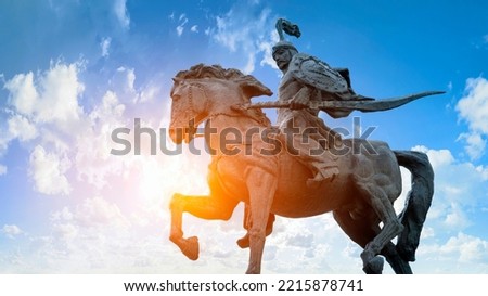 Statue of the hero Manas representing the epic of Manas against the background of the sky of Kyrgyzstan on Alatau Square in Bishkek KYRGYZSTAN