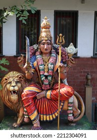 Statue Of Hindu Deity And A Lion Next To It