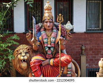 Statue Of Hindu Deity And A Lion Next To It