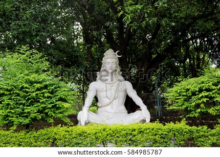 Statue of Hindu Lord Shiva under the tree, Rishikesh. India