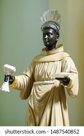 Statue With Image Of St. Benedict On Altar Decorated With Flowers, OFM Cap, Order Of Friars Minor Capuchin (Ordo Fratrum Minorum Capuccinorum)