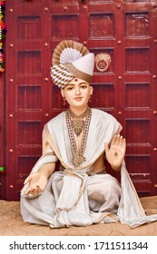 Statue of Indian Lord Swaminarayan blessing wallpaper design