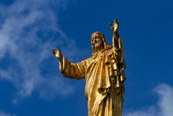 Statue Of Jesus Christ Against The Background Of The Blue Sky. Basilica Of Our Lady Of The Rosary, Sanctuary Of Fatima, Portugal.