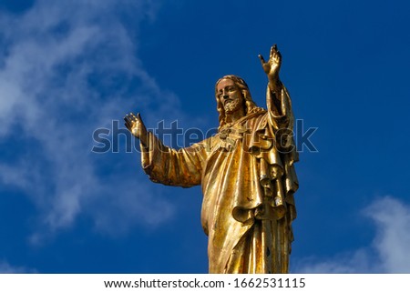 Statue of Jesus Christ against the background of the blue sky. Basilica of Our Lady of the Rosary, Sanctuary of Fatima, Portugal.