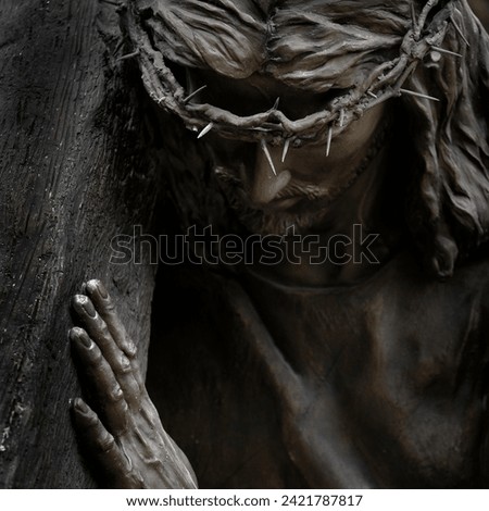 Statue of Jesus Christ the Savior of the World with crown of thorns from crucifixion atonement and resurrection cross