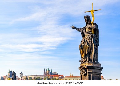 Statue of John the Baptist on Charles Bridge and skyline of Prague, Czech Republic.  Sculpture:  Josef Max, 1857 