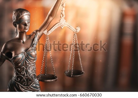 Statue of justice and book.