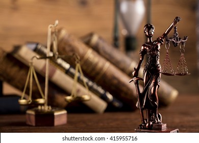 Statue of justice, scales of justice,books, hourglass, law theme - Shutterstock ID 415955716