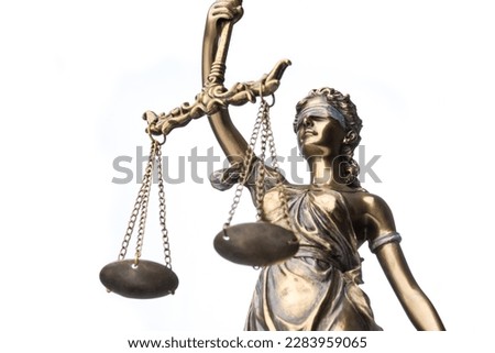 The statue of justice Themis or Justitia isolated on white background