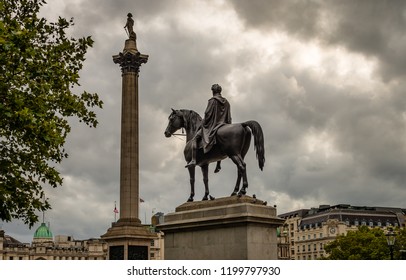 The Statue Of King George IV And The Nelson Column In Trafalgar Square, In London, UK, On A Cloudy Afternoon, In The Fall.