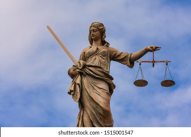 Statue Of Lady Justice At Dublin Castle In Dublin, Ireland,Stature Of Lady With Sword Holding Scales Of Justice On Top Of Dublin Castle Buildings.