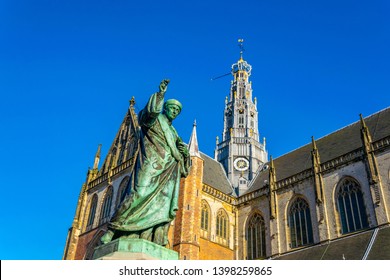 Statue of Laurens Janszoon Coster and Saint Bavo church in Haarlem, Netherlands