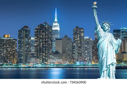 The Statue of Liberty with cityscape in Manhattan at night, New York City, USA