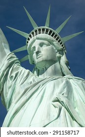 Statue Of Liberty Close-up Vertical Profile With Crown Against Blue Sky