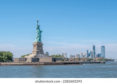 Statue of Liberty during sunny day in New York. Symbol freedom of the USA.  - Powered by Shutterstock