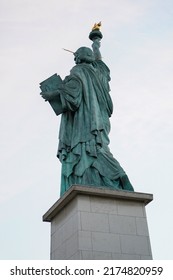 Statue of Liberty on the Ile aux Cygnes, River Seine in Paris. The grandest replica of all is just off the Grenelle Bridge on the little man-made island called Ile aux Cygnes.
