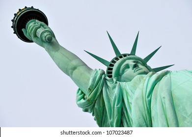 Statue of liberty on Liberty Island in New York harbor, New York City, New York, United States of America.Low angle view isolated on clear blue sky background. 4th of July holiday.No people.Copy space - Powered by Shutterstock