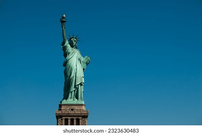 The Statue of Liberty over a blue sky, New York city