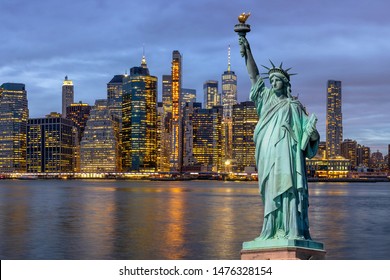 The Statue of Liberty over the Scene of New york Cityscape with Brooklyn Bridge beside the east river at the twilight time,Architecture and building with tourist concept, United state of America, USA - Shutterstock ID 1476328154