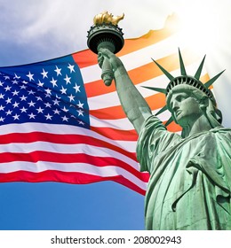 Statue of Liberty, sunny sky and USA flag background
