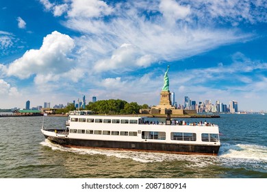 Statue Of Liberty And Tourist Ship Ferry In New York City, NY, USA