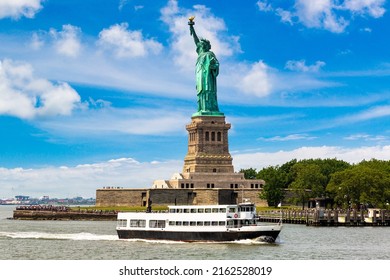 Statue of Liberty and tourist ship ferry in New York City, NY, USA - Shutterstock ID 2162528019