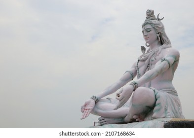 Statue of lord Shiva from every angle.RISHIKESH, INDIA , Statue of Shiva, Hindu idol near Ganges River water, Rishikesh, India. The first Hindu God Shiva. Sacred places for pilgrims in Rishikesh. 